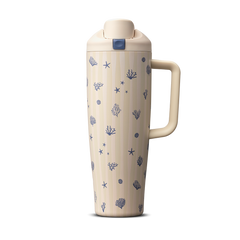 Owala Birthday Bash Coral Cabana 30oz FreeSip Tumbler; cream body with subtle vertical stripes scattered with small navy blue seashells, starfish, coral, and sea urchin illustrations, matching cream flip cap, lid, and side handle