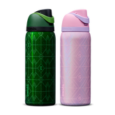 Owala Wicked 32oz FreeSip bundle showing two bottles side by side — deep emerald green Elphaba edition with geometric diamond-pattern texture and dark green flip cap, and shimmery iridescent lavender-pink Glinda edition with pink flip cap