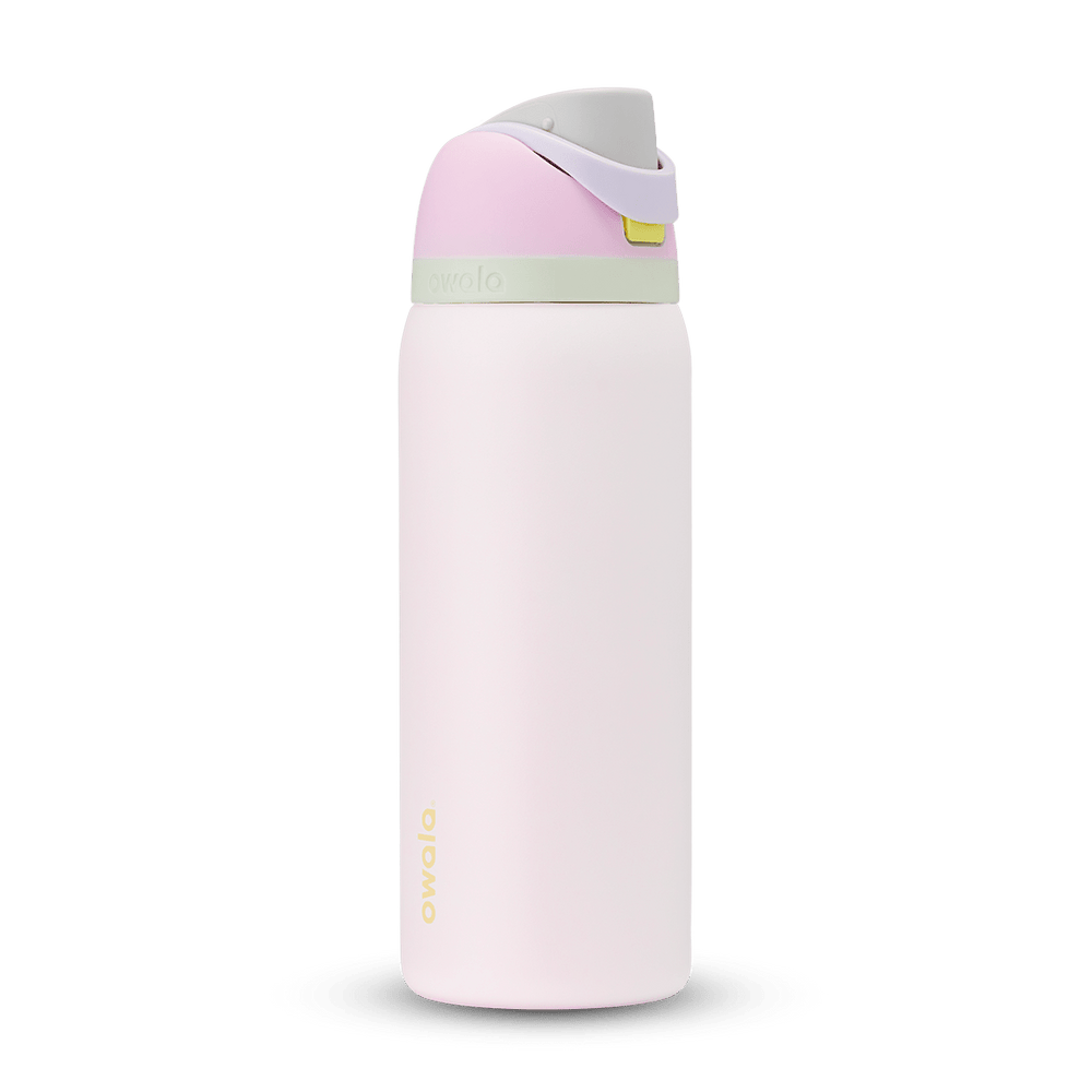 FreeSip 32oz water bottle, soft blush pink body with pale pink and sage green color-block flip cap
